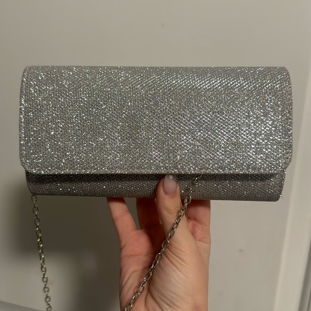 Brand new silver clutch with optional chain strap